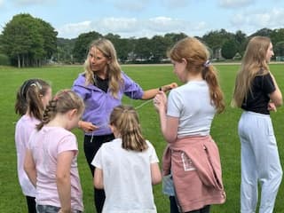 Children enjoying science and outdoor play at the holiday club